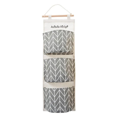 Hanging Storage Bag made from durable linen cloth with waterproof coating, featuring three spacious pockets for convenient organisation