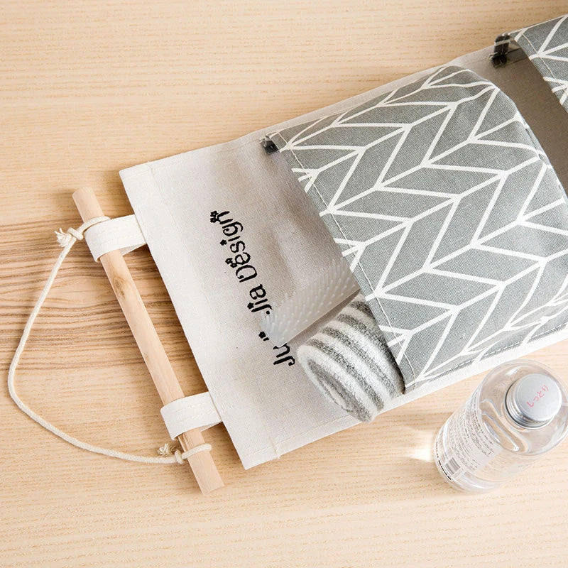 Hanging Storage Bag made from durable linen cloth with waterproof coating, featuring three spacious pockets for convenient organisation