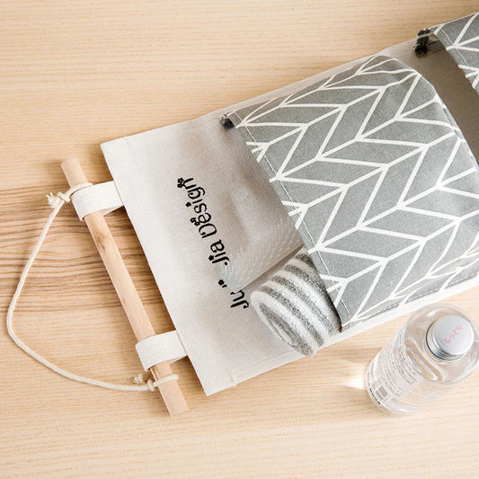 Hanging Storage Bag made from durable linen cloth with waterproof coating, featuring three spacious pockets for convenient organisation