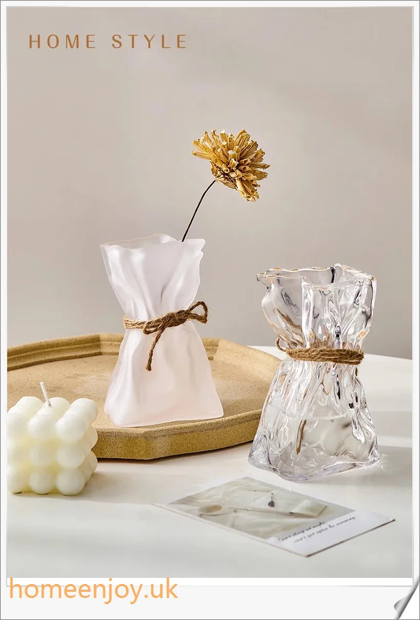 Elegant glass vase with dried flower arrangement, a sophisticated home decor accent