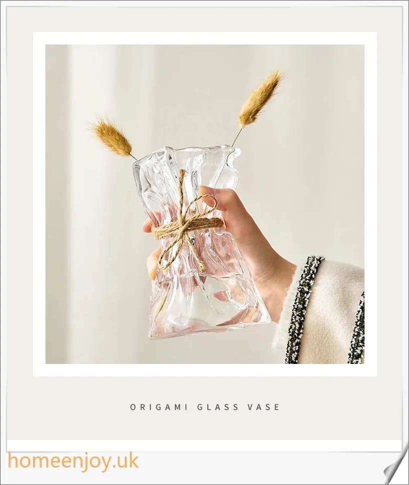 Elegant glass vase with dried flower arrangement, a sophisticated home decor accent