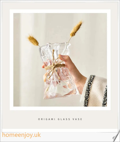 Elegant glass vase with dried flower arrangement, a sophisticated home decor accent