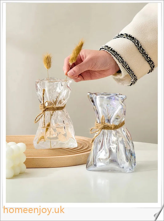 Elegant glass vase with dried flower arrangement, a sophisticated home decor accent