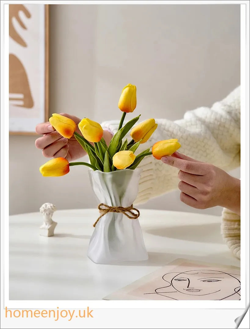 Elegant glass vase with dried flower arrangement, a sophisticated home decor accent