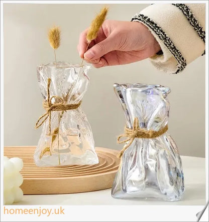 Elegant glass vase with dried flower arrangement, a sophisticated home decor accent