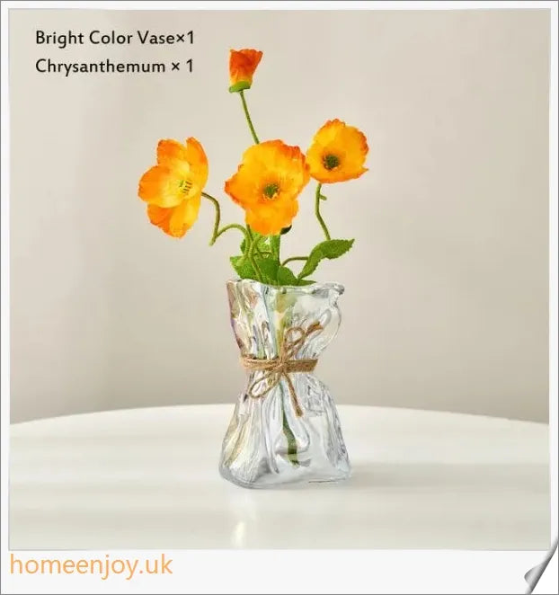 Elegant glass vase with dried flower arrangement, a sophisticated home decor accent