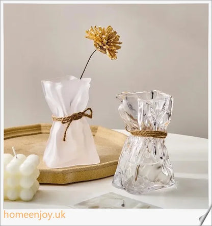 Elegant glass vase with dried flower arrangement, a sophisticated home decor accent