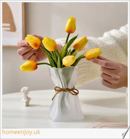 Elegant glass vase with dried flower arrangement, a sophisticated home decor accent