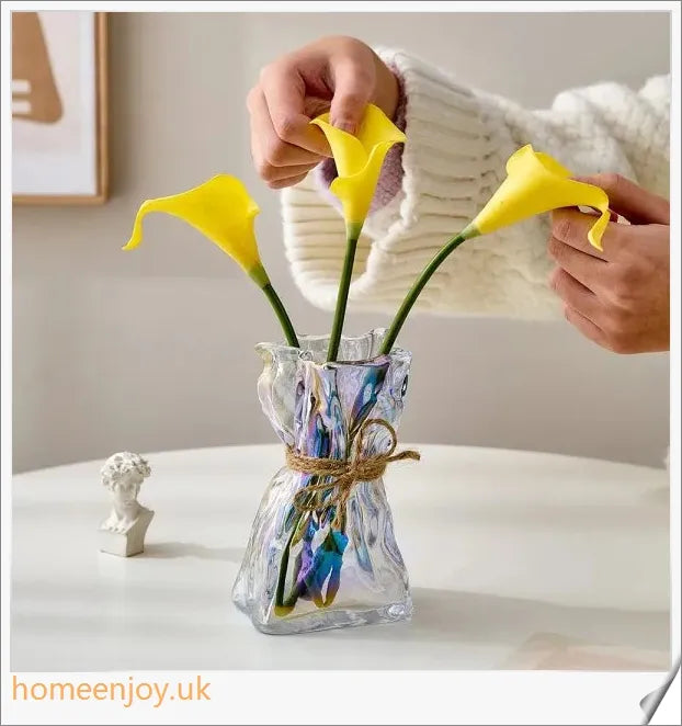 Elegant glass vase with dried flower arrangement, a sophisticated home decor accent
