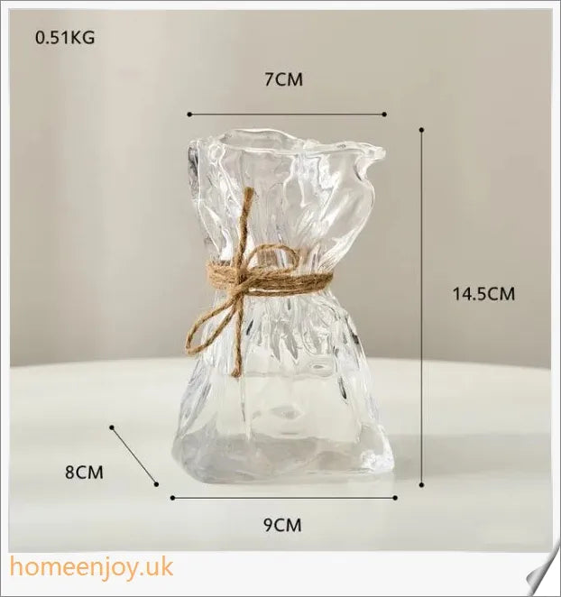 Elegant glass vase with dried flower arrangement, a sophisticated home decor accent