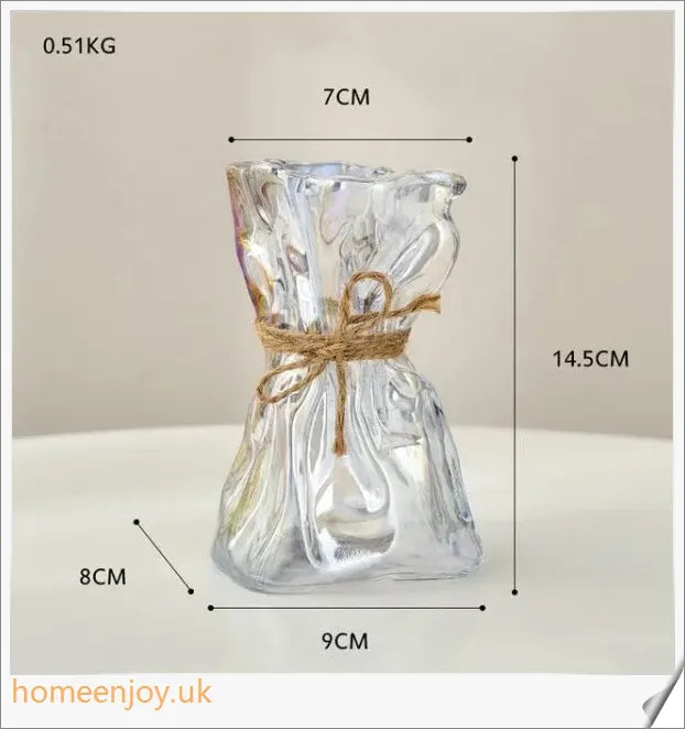 Elegant glass vase with dried flower arrangement, a sophisticated home decor accent