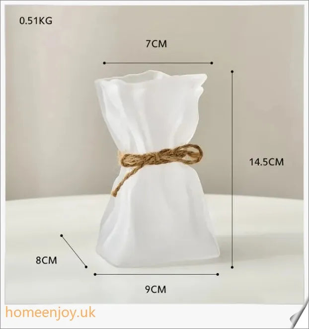 Elegant glass vase with dried flower arrangement, a sophisticated home decor accent