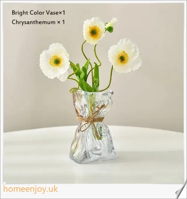 Elegant glass vase with dried flower arrangement, a sophisticated home decor accent