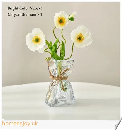 Elegant glass vase with dried flower arrangement, a sophisticated home decor accent
