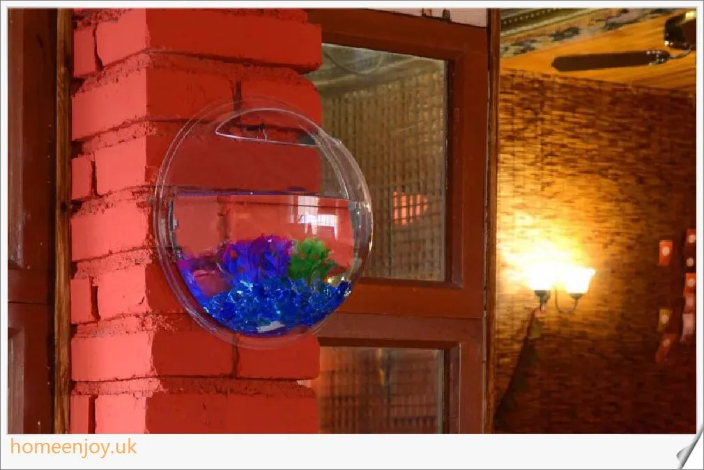 Elegant wall-mounted Betta fish aquarium made of transparent acrylic, showcasing aquatic pets in a stylish and space-saving display.