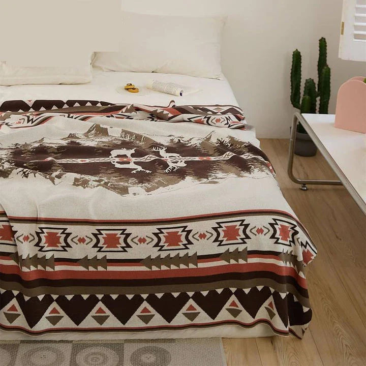 Cosy 100% cotton throw blanket with a scenic design of an elk in a mountain forest reflected in calm waters