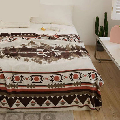 Cosy 100% cotton throw blanket with a scenic design of an elk in a mountain forest reflected in calm waters