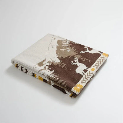 Cosy 100% cotton throw blanket with a scenic design of an elk in a mountain forest reflected in calm waters