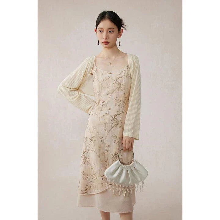 Elegant floral A-line midi dress with lace details, perfect for summer occasions
