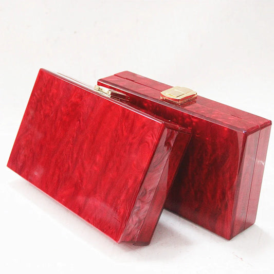 Pearlescent acrylic one-shoulder messenger bag in a stylish red colour, perfect for formal events and everyday use.