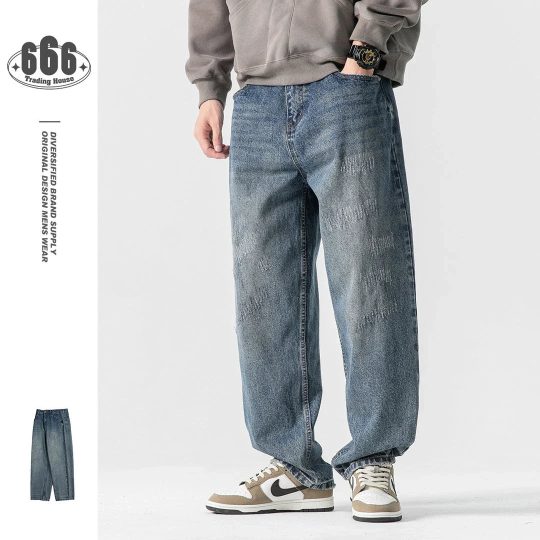 Autumn New Retro Loose Jeans in dark blue, featuring a tapered leg design and unique printing techniques for a vintage-inspired look.