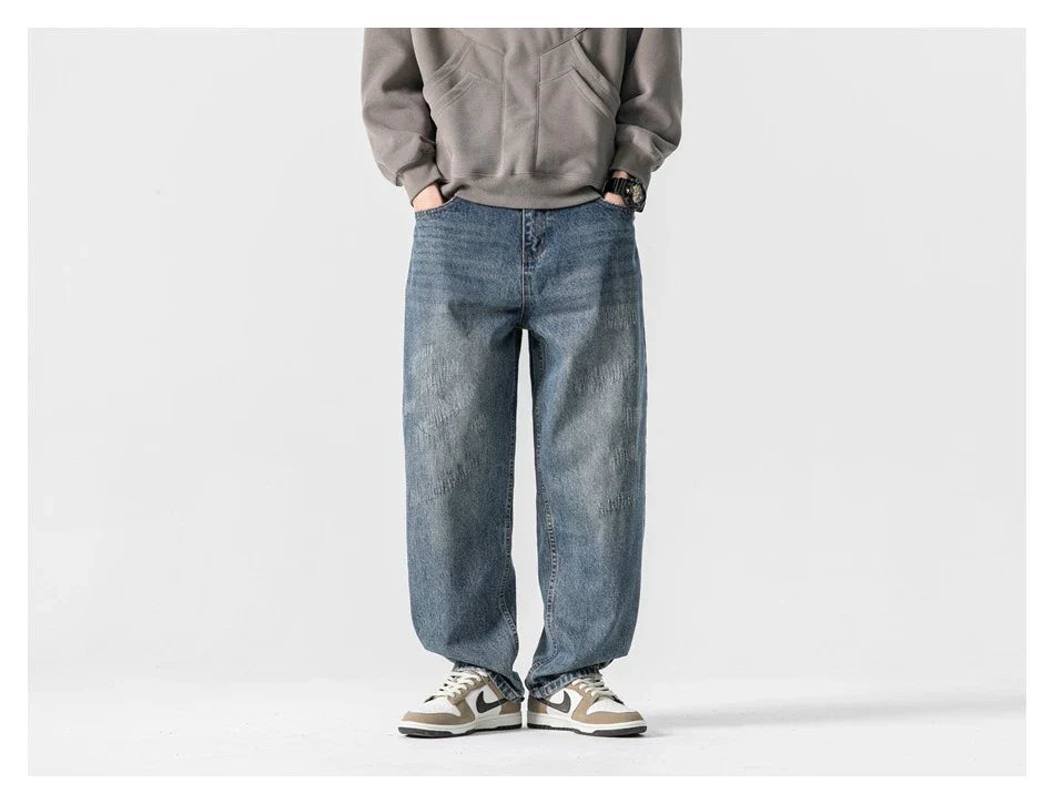 Autumn New Retro Loose Jeans in dark blue, featuring a tapered leg design and unique printing techniques for a vintage-inspired look.