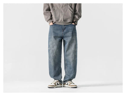 Autumn New Retro Loose Jeans in dark blue, featuring a tapered leg design and unique printing techniques for a vintage-inspired look.