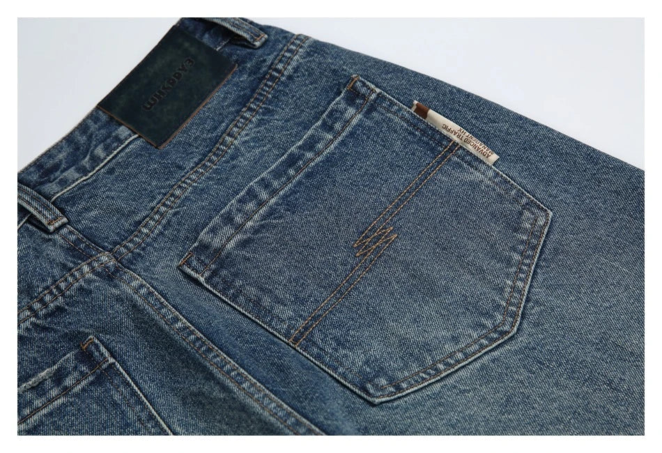 Autumn New Retro Loose Jeans in dark blue, featuring a tapered leg design and unique printing techniques for a vintage-inspired look.