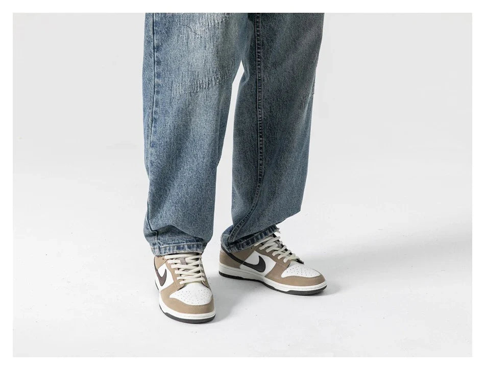 Autumn New Retro Loose Jeans in dark blue, featuring a tapered leg design and unique printing techniques for a vintage-inspired look.