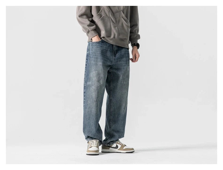Autumn New Retro Loose Jeans in dark blue, featuring a tapered leg design and unique printing techniques for a vintage-inspired look.
