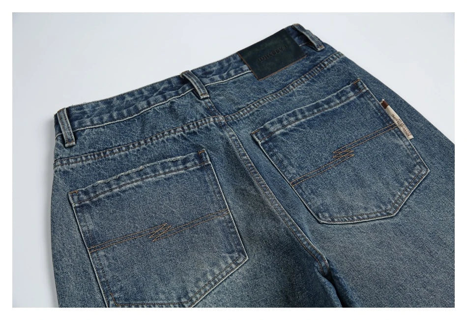 Autumn New Retro Loose Jeans in dark blue, featuring a tapered leg design and unique printing techniques for a vintage-inspired look.