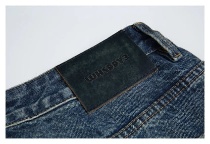 Autumn New Retro Loose Jeans in dark blue, featuring a tapered leg design and unique printing techniques for a vintage-inspired look.
