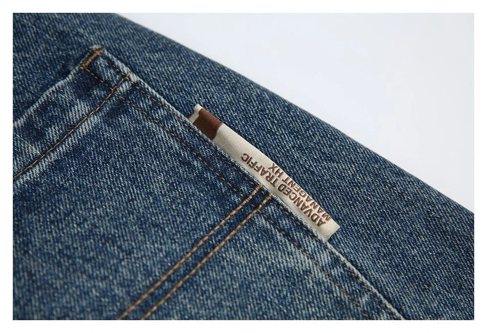 Autumn New Retro Loose Jeans in dark blue, featuring a tapered leg design and unique printing techniques for a vintage-inspired look.