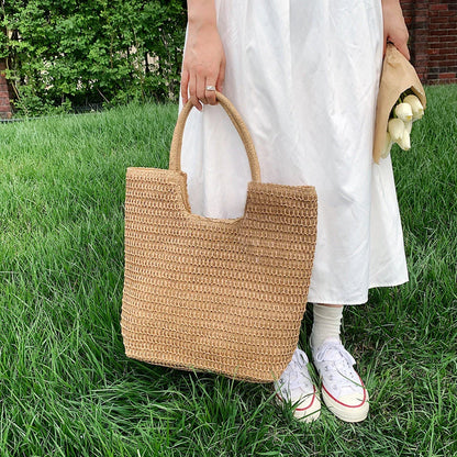Handmade straw woven shoulder bag in beige, a stylish and versatile summer accessory