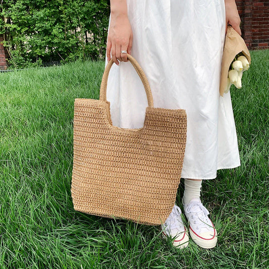 Handmade straw woven shoulder bag in beige, a stylish and versatile summer accessory