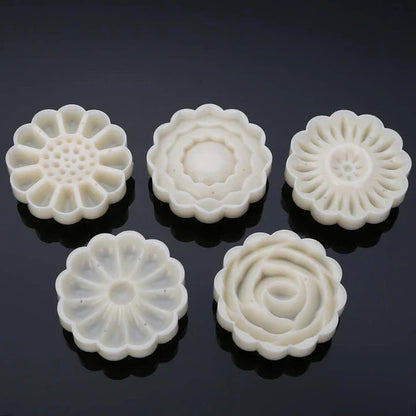 A set of 7 premium food-grade plastic cake moulds in the shape of elegant 3D roses, perfect for creating stunning floral baked treats at home.
