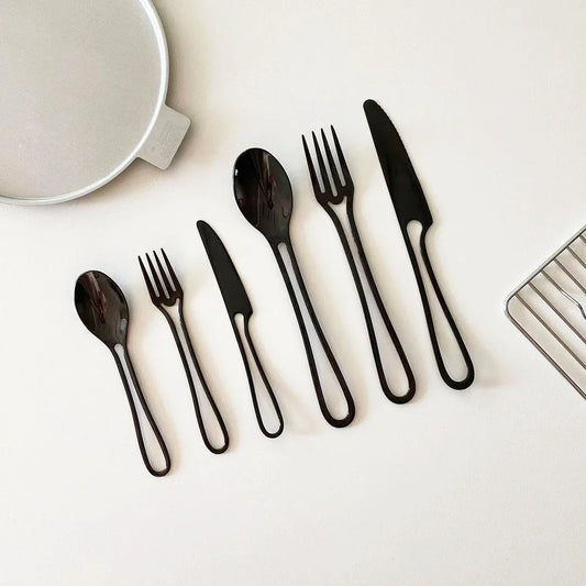 Trendha 304 Stainless Steel Cutlery Set - Sleek black finish, durable construction, and contemporary design for an elevated dining experience.