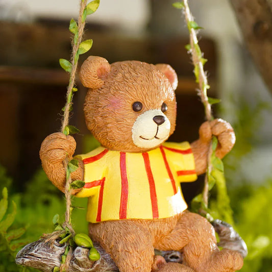 Charming resin ornament depicting a mother bear and her child on a swing, adding a touch of whimsy and warmth to any decor