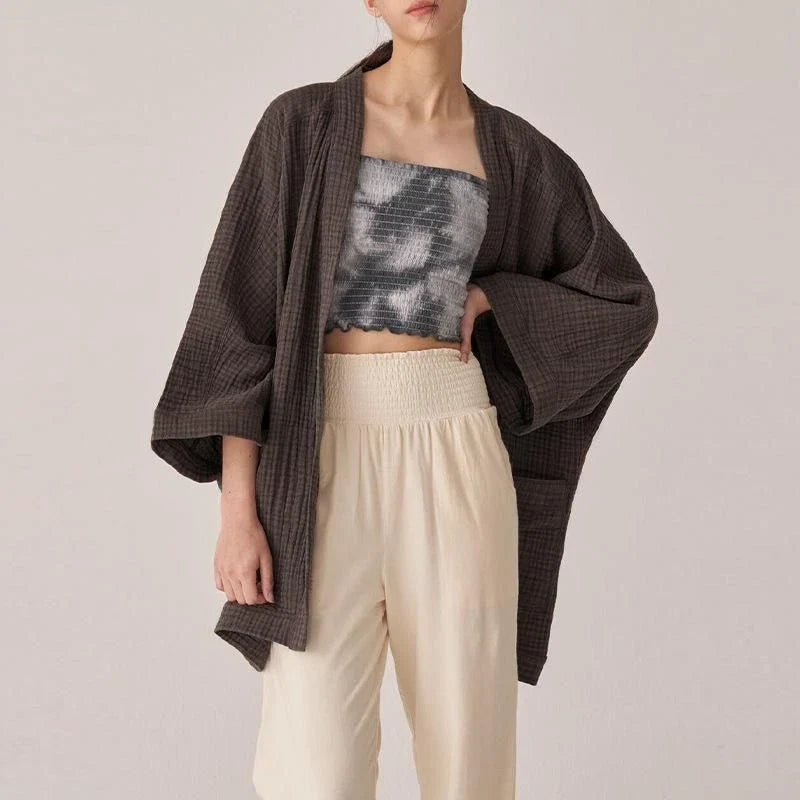 Chic cotton cardigan with open-stitch design, offering breathable and soft comfort for everyday wear.