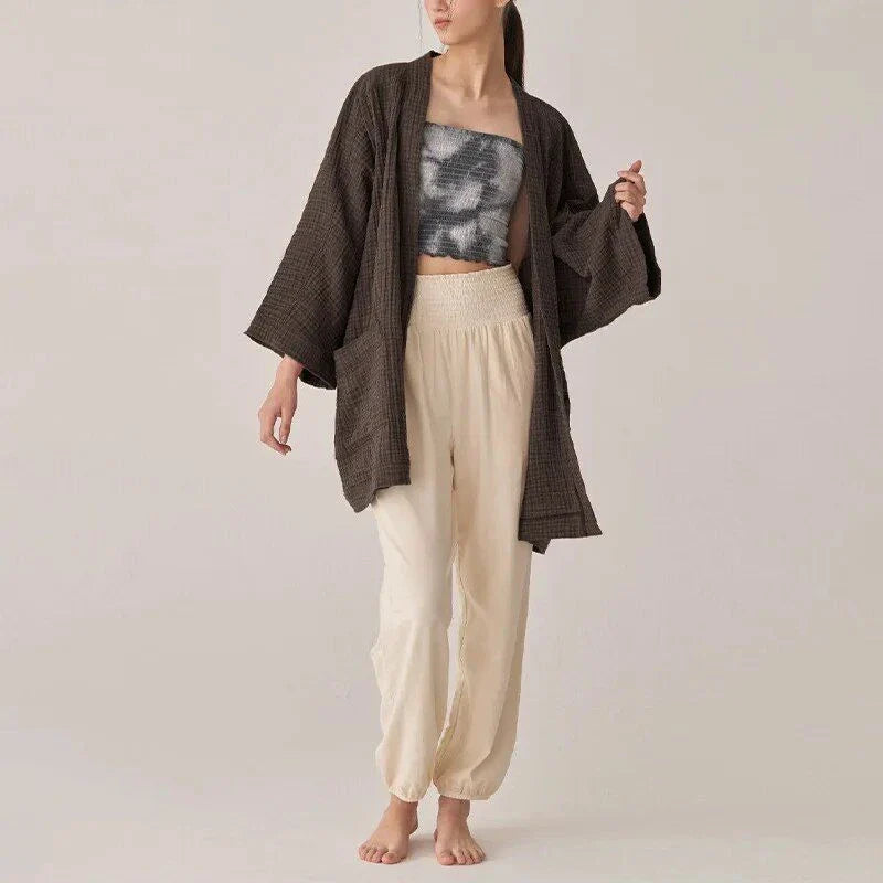 Chic cotton cardigan with open-stitch design, offering breathable and soft comfort for everyday wear.