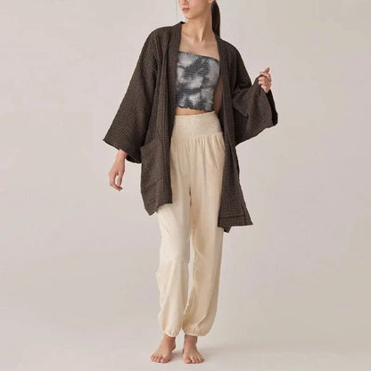 Chic cotton cardigan with open-stitch design, offering breathable and soft comfort for everyday wear.