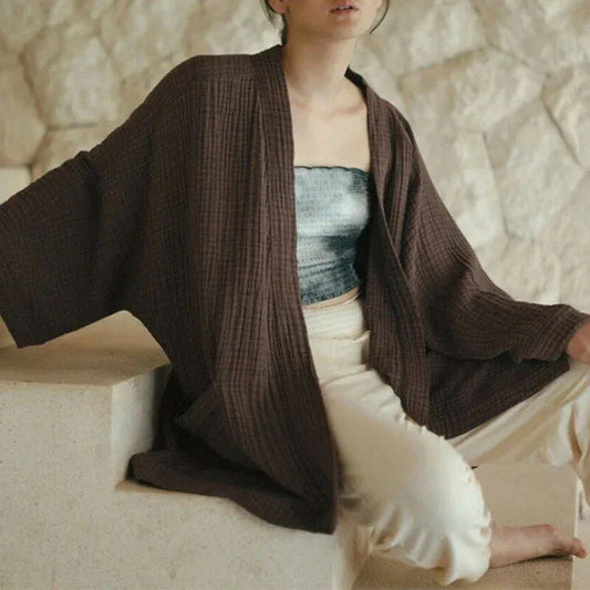 Chic cotton cardigan with open-stitch design, offering breathable and soft comfort for everyday wear.