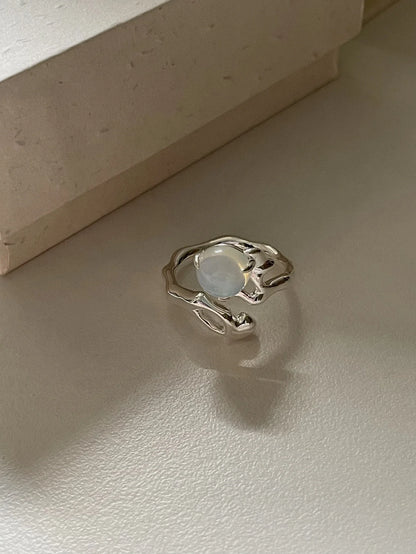 Adjustable sterling silver ring with natural zirconia stones, a versatile and elegant accessory.