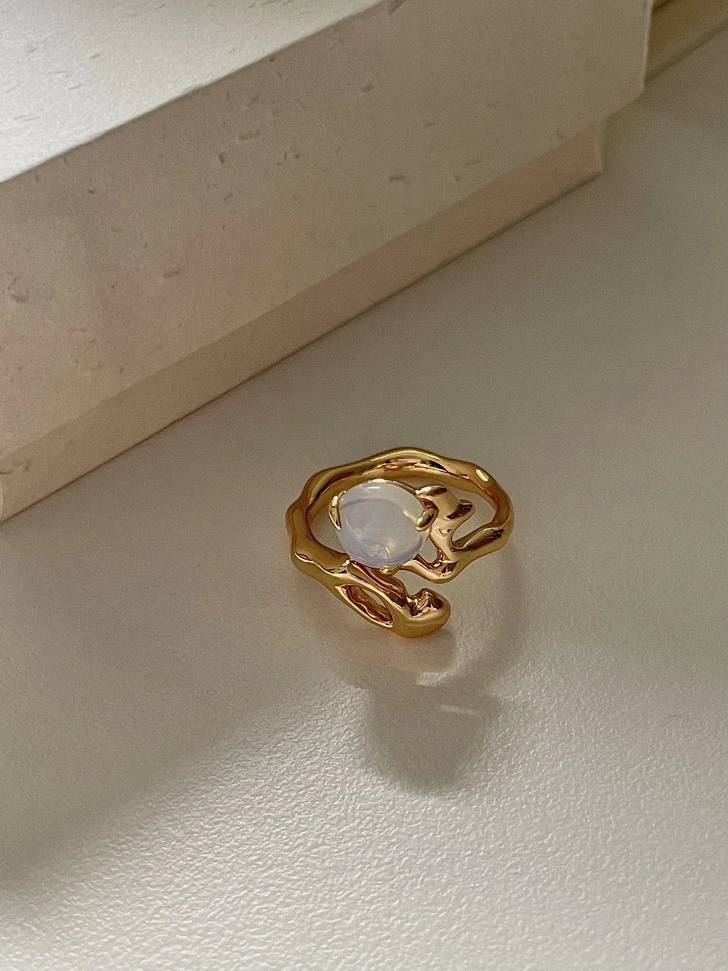 Adjustable sterling silver ring with natural zirconia stones, a versatile and elegant accessory.