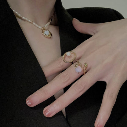 Adjustable sterling silver ring with natural zirconia stones, a versatile and elegant accessory.