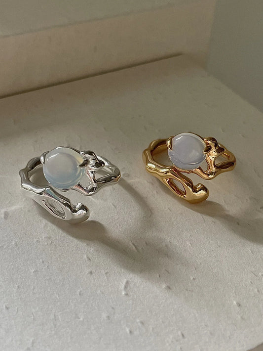 Adjustable sterling silver ring with natural zirconia stones, a versatile and elegant accessory.
