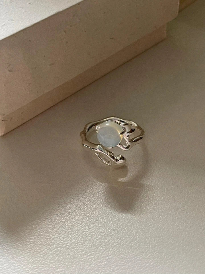 Adjustable sterling silver ring with natural zirconia stones, a versatile and elegant accessory.