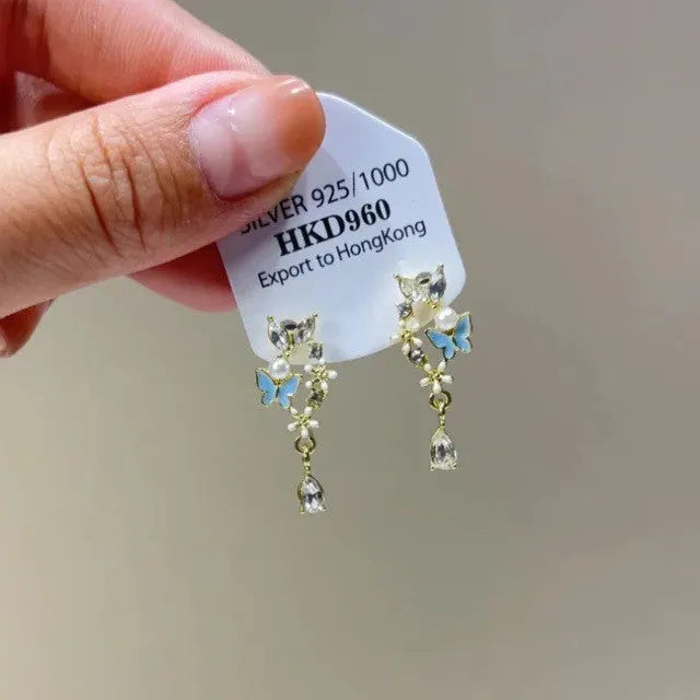 Geometric alloy ear clip with rhinestone stars, tassel and heart decoration for women