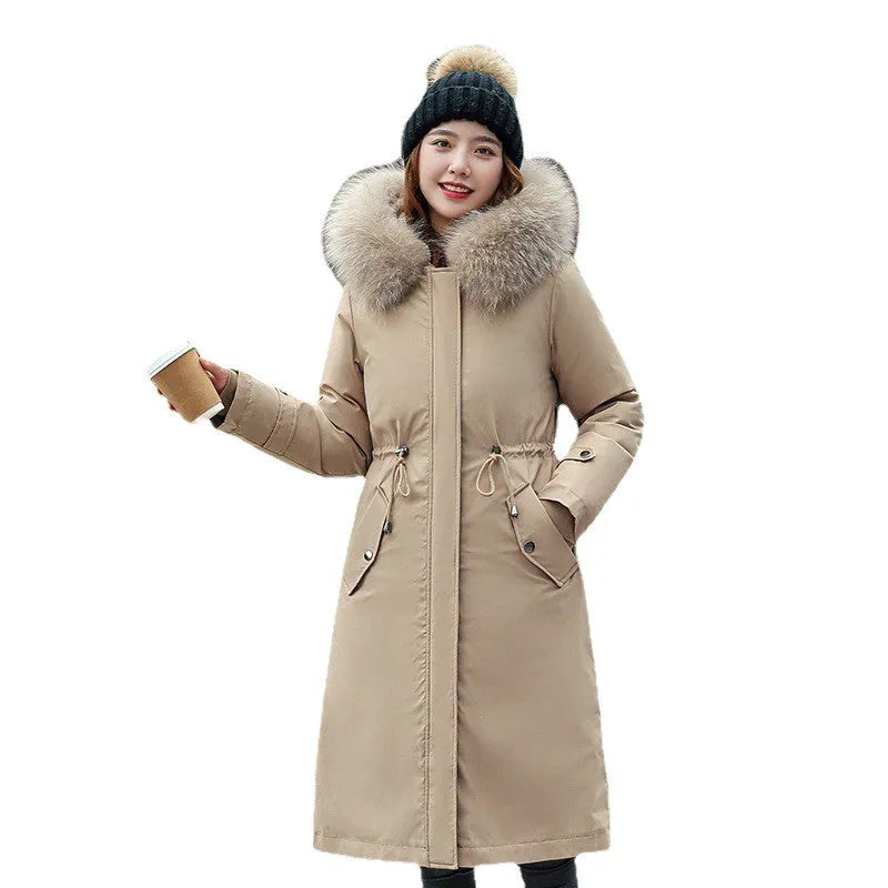 Women's long padded beige trench coat with a fleece lining, shown on a model.