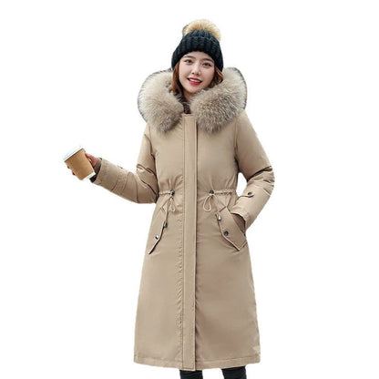 Women's long padded beige trench coat with a fleece lining, shown on a model.